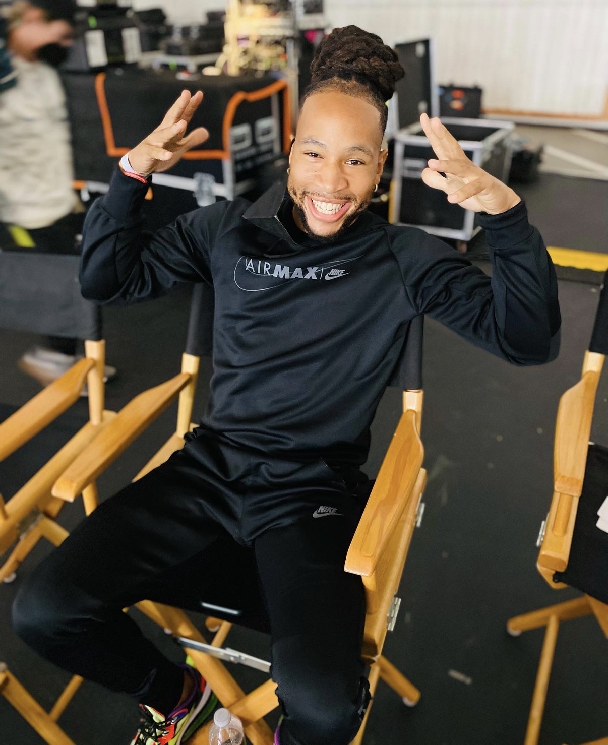 Giles Chapman seated on set during a production